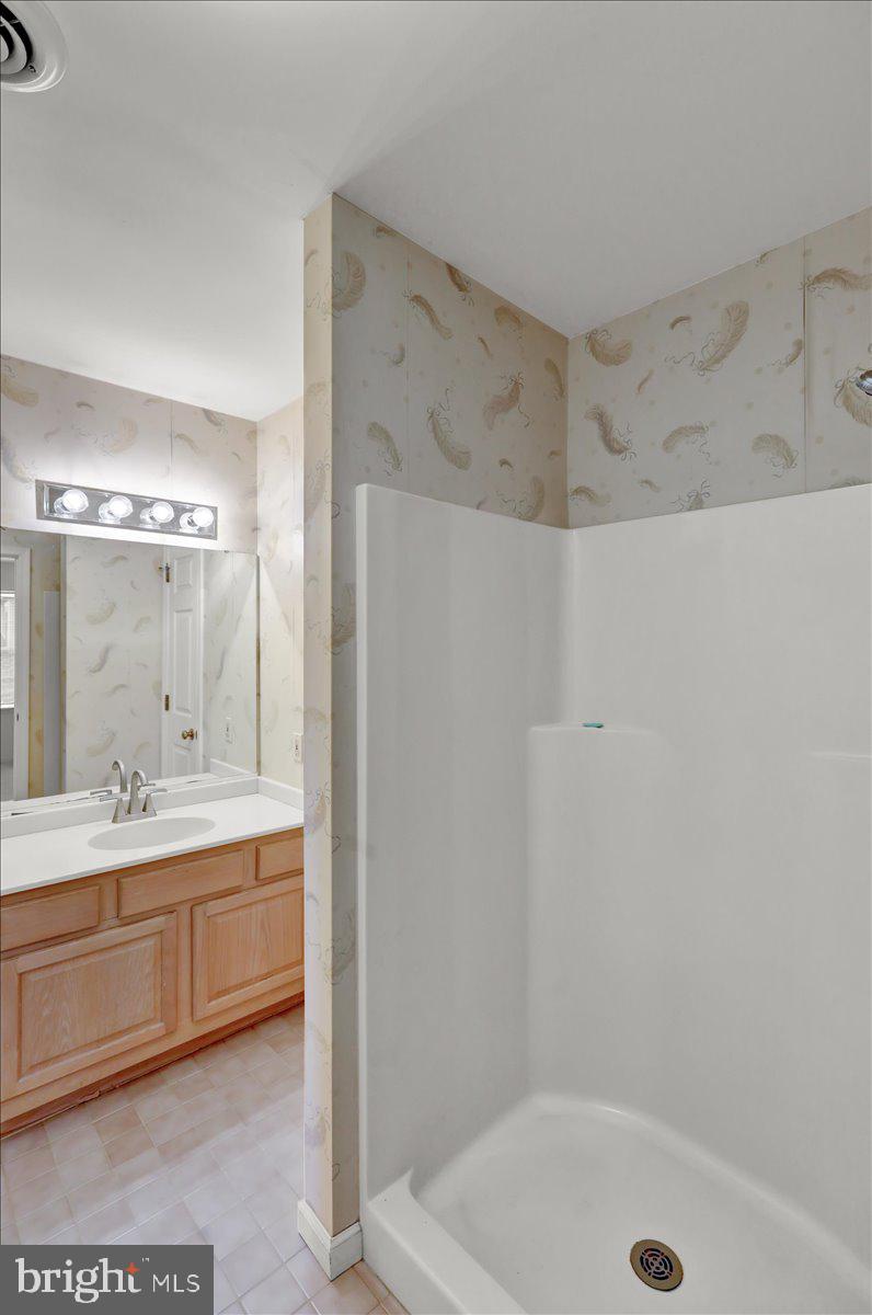 101 Heather Lane Reading, PA 19610 - Photo 23 of 38 a bathroom with a sink a toilet and shower