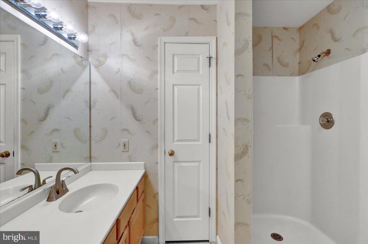 101 Heather Lane Reading, PA 19610 - Photo 24 of 38 a bathroom with a sink and shower