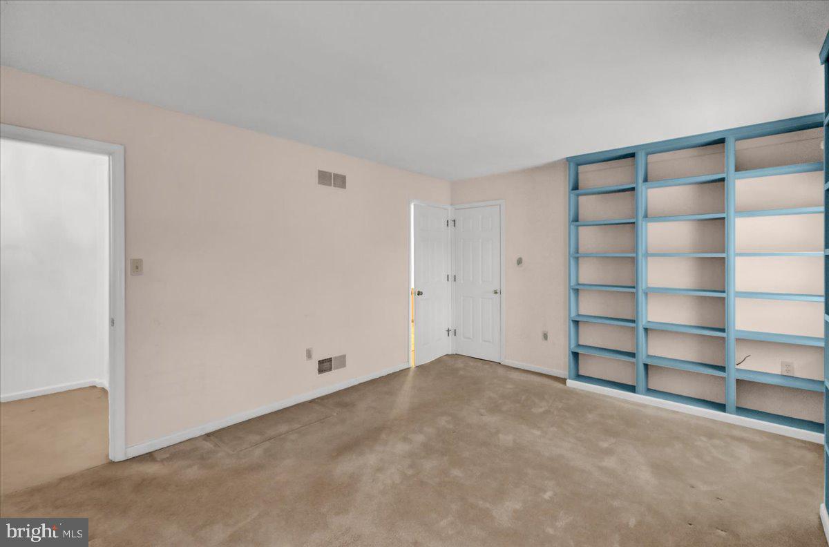 101 Heather Lane Reading, PA 19610 - Photo 30 of 38 a view of an empty room with empty shelves