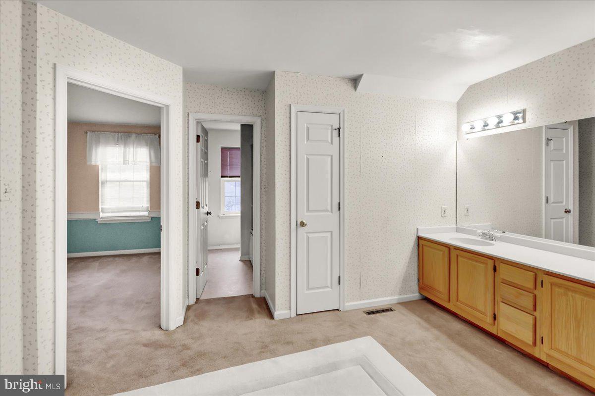 101 Heather Lane Reading, PA 19610 - Photo 31 of 38 a view of a bathroom with a sink and mirror
