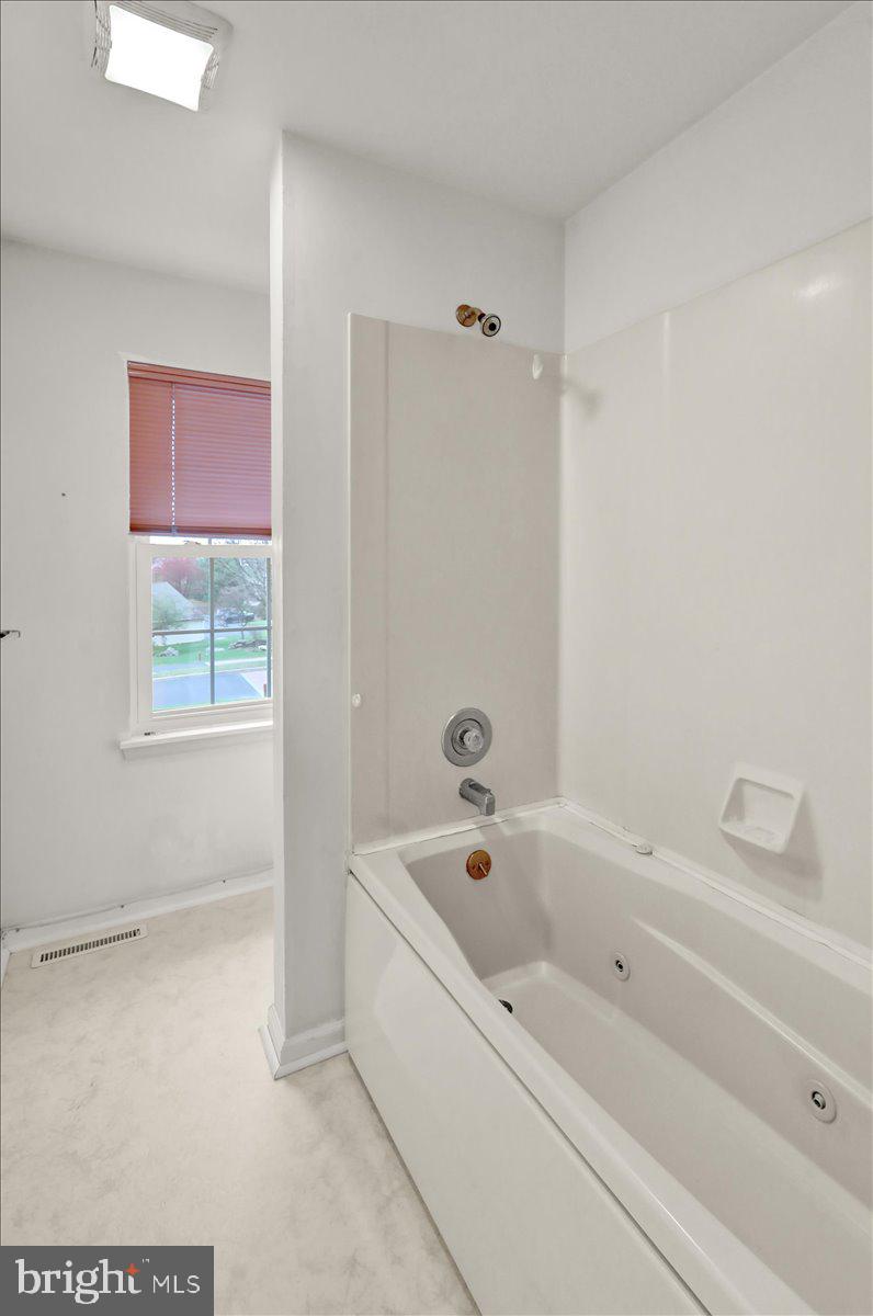 101 Heather Lane Reading, PA 19610 - Photo 34 of 38 a white bath tub sitting next to a window