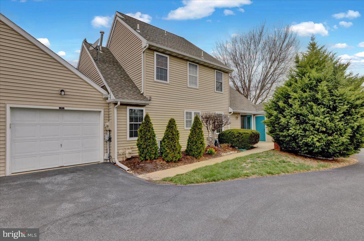 101 Heather Lane Reading, PA 19610 - Photo 5 of 38 a view of a house with a yard and potted plants