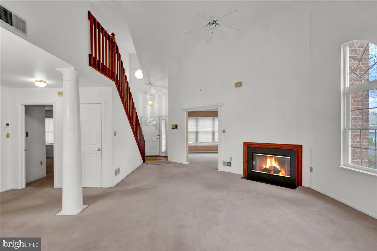 101 Heather Lane Reading, PA 19610 - Photo 9 of 38 a view of an empty room with wooden floor and windows
