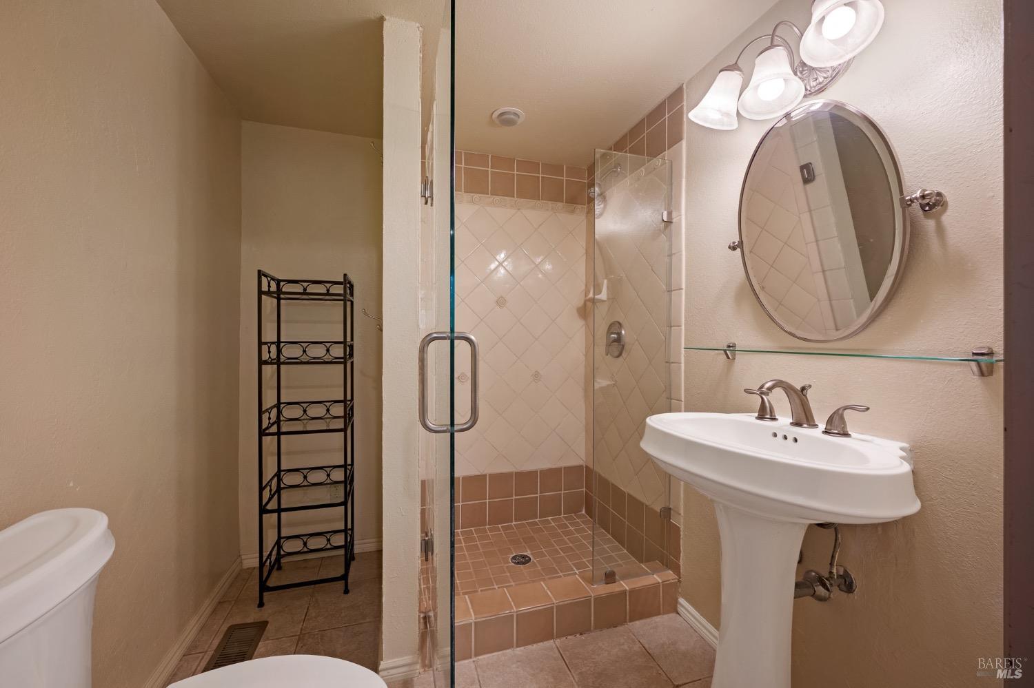 4727 Woodview Drive Santa Rosa, CA 95405 - Photo 16 of 46 a bathroom with a sink a toilet and shower