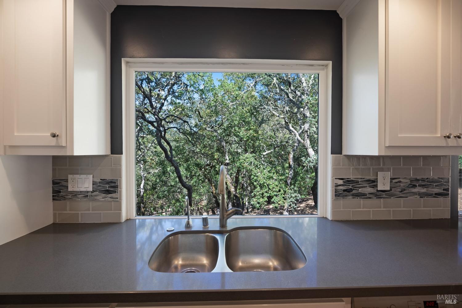 4727 Woodview Drive Santa Rosa, CA 95405 - Photo 22 of 46 a kitchen with a sink and a large window