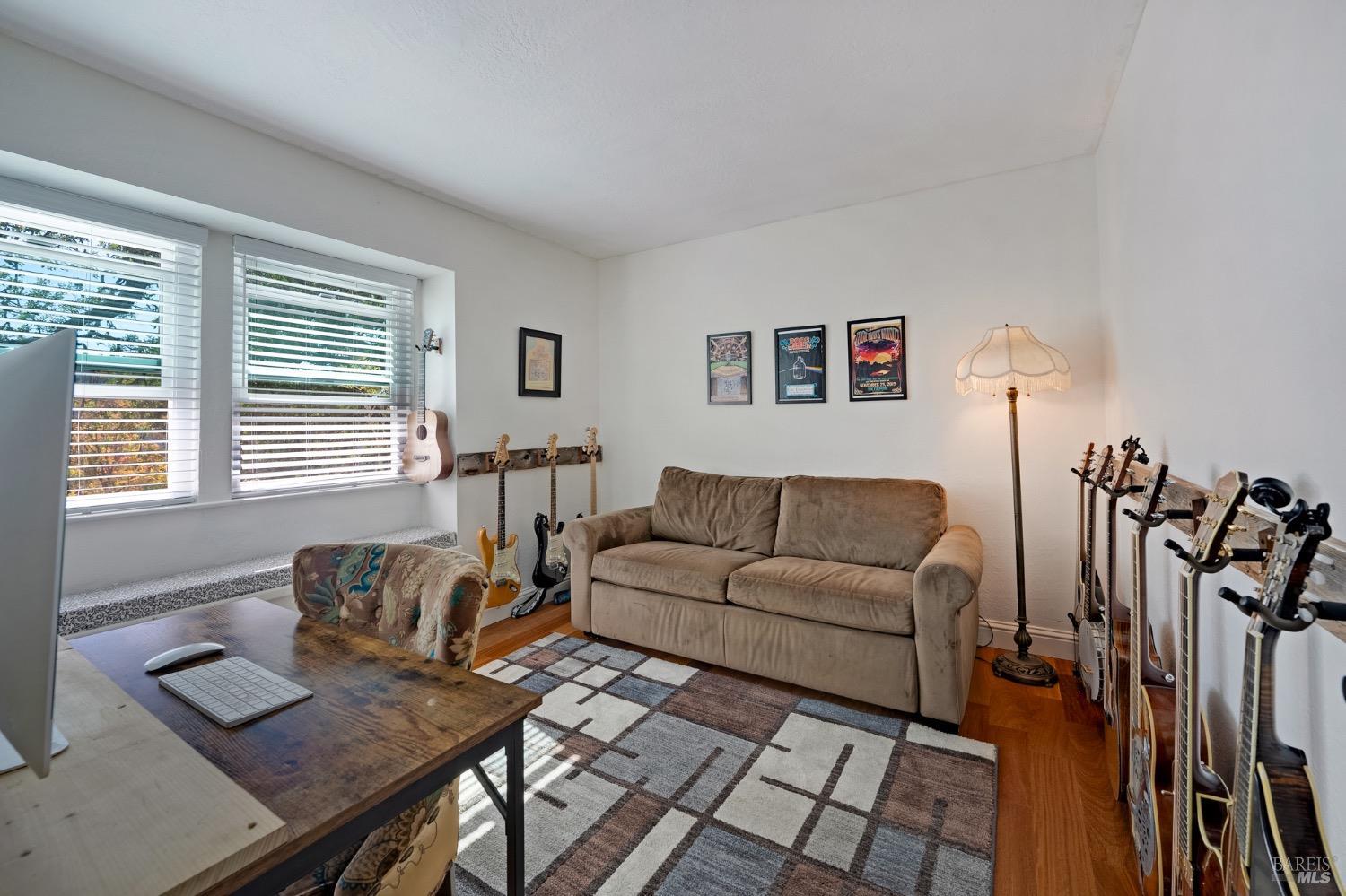 4727 Woodview Drive Santa Rosa, CA 95405 - Photo 34 of 46 a living room with furniture and a flat screen tv