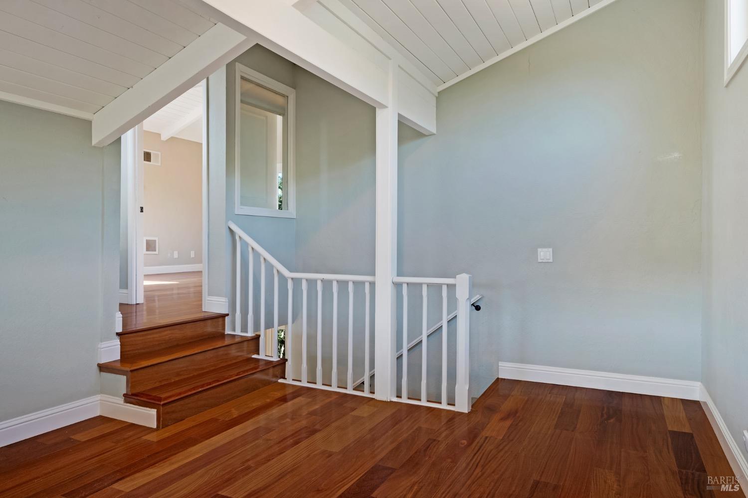 4727 Woodview Drive Santa Rosa, CA 95405 - Photo 39 of 46 a view of a hallway with wooden floor and staircase