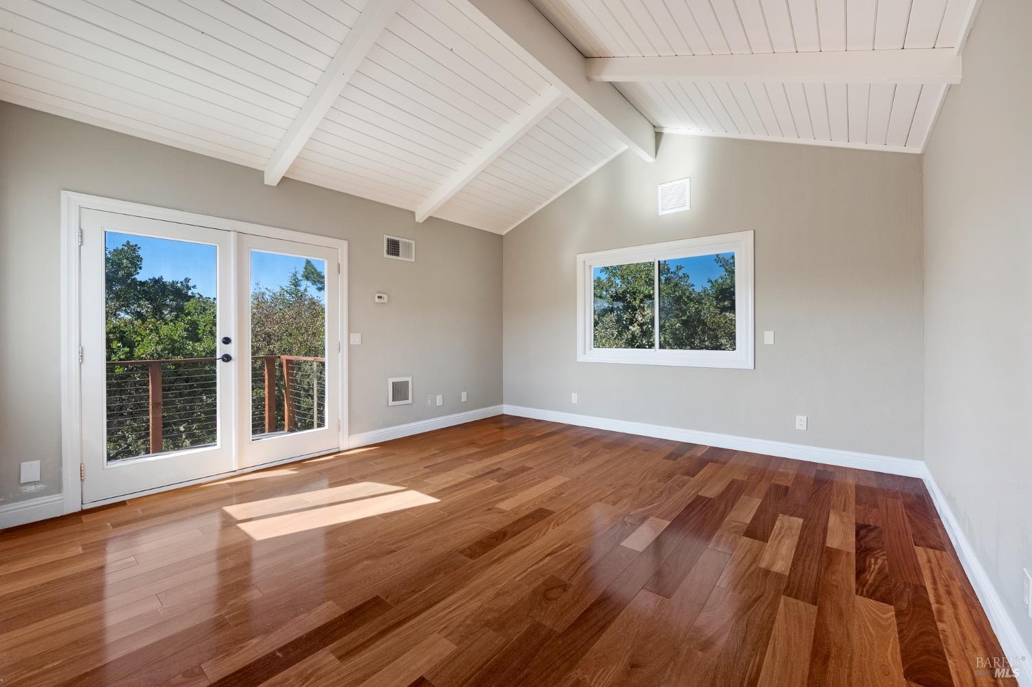 4727 Woodview Drive Santa Rosa, CA 95405 - Photo 40 of 46 a view of an empty room with wooden floor and a window