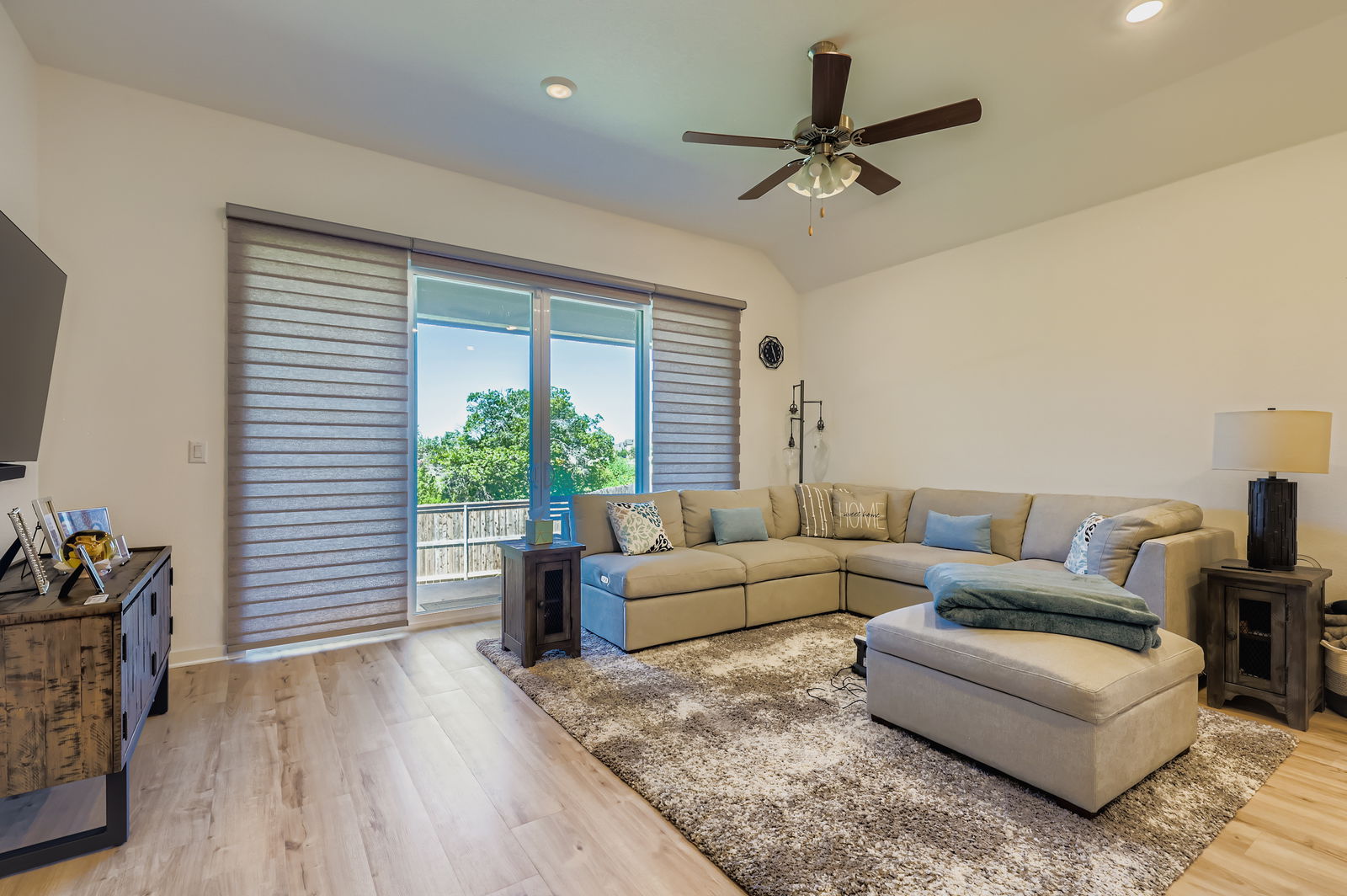 1909 Ruger Pass Leander, TX 78641 - Photo 5 of 31 Living area featuring a ceiling fan, light wood-style floors, recessed lighting, and lofted ceiling