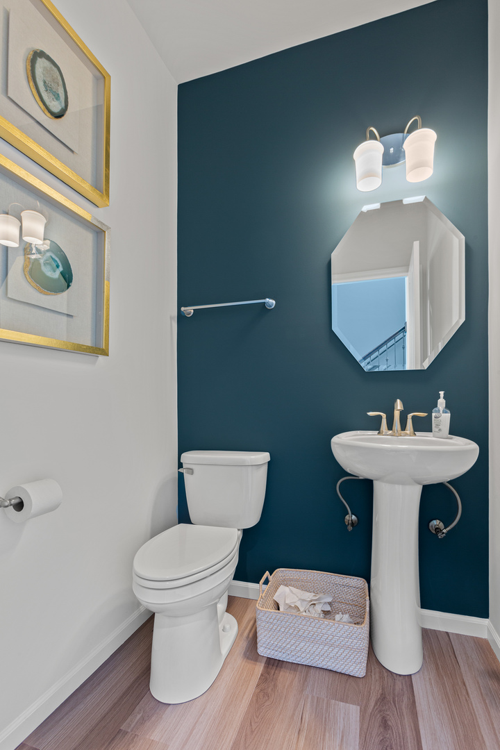 2206 Weatherbee Lane Naperville, IL 60563 - Photo 3 of 19 a bathroom with a toilet a sink and mirror