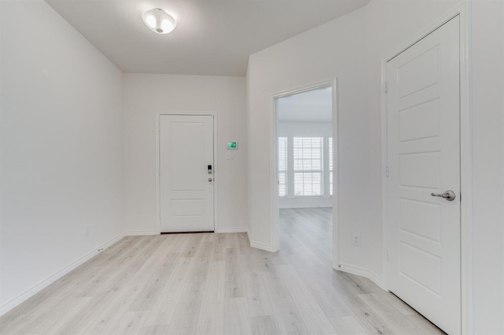 4108 Forest Bend Road Denton, TX 76208 - Photo 4 of 22 back of the front door and looking into the up front secondary bedroom