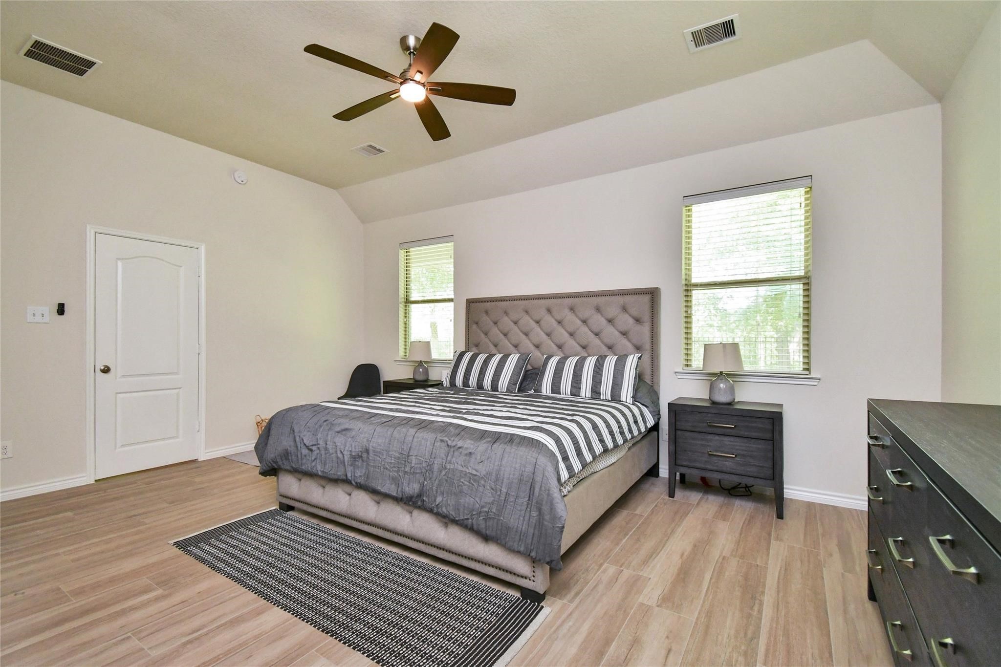 22 Wood Drake Place Tomball, TX 77375 - Photo 13 of 21 a bedroom with a bed and a window