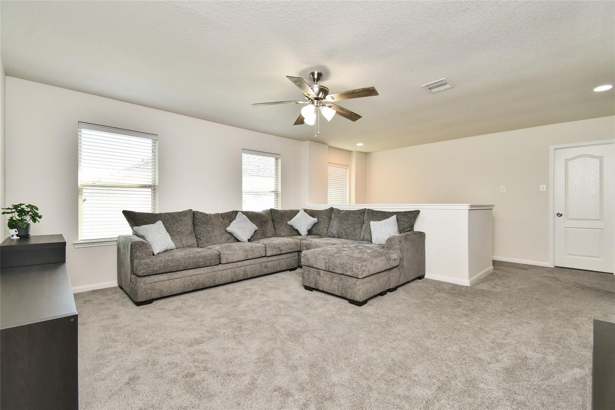 22 Wood Drake Place Tomball, TX 77375 - Photo 16 of 21 a living room with furniture and a ceiling fan