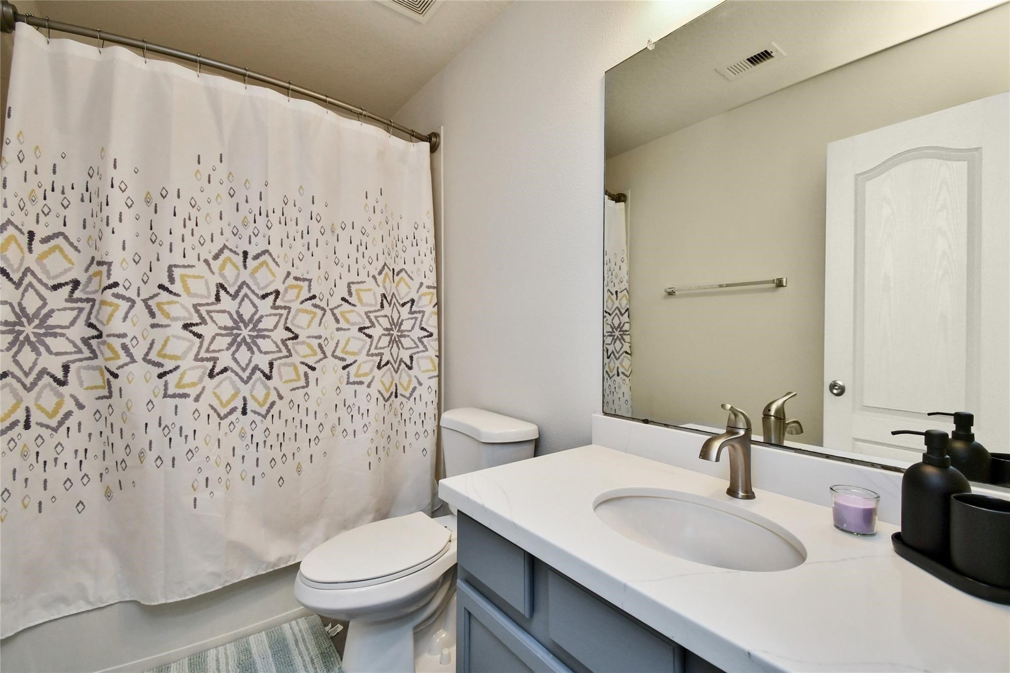 22 Wood Drake Place Tomball, TX 77375 - Photo 19 of 21 a bathroom with a sink toilet and a mirror