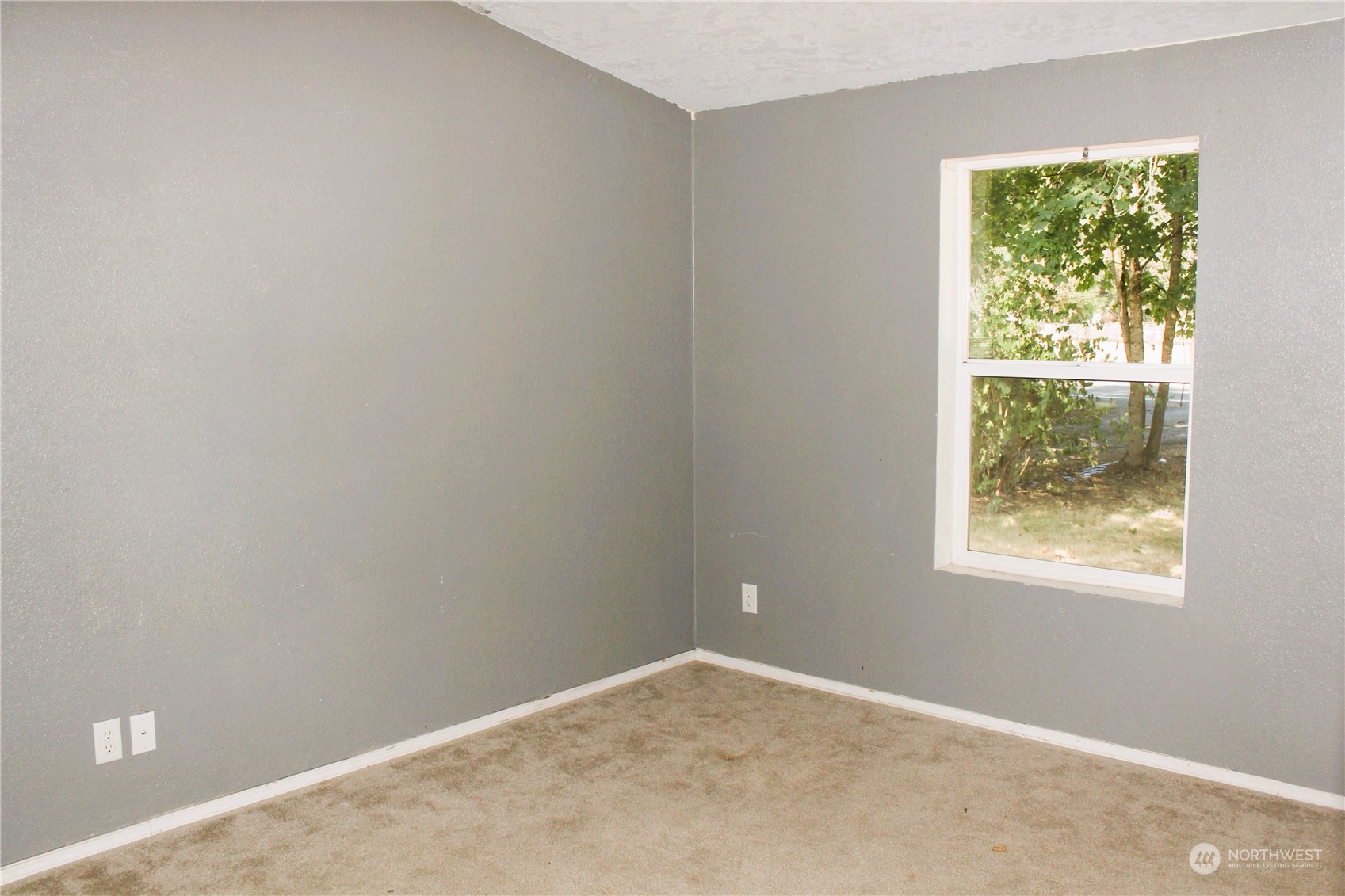8145 183rd Avenue Southwest Rochester, WA 98579 - Photo 17 of 33 an empty room with a window