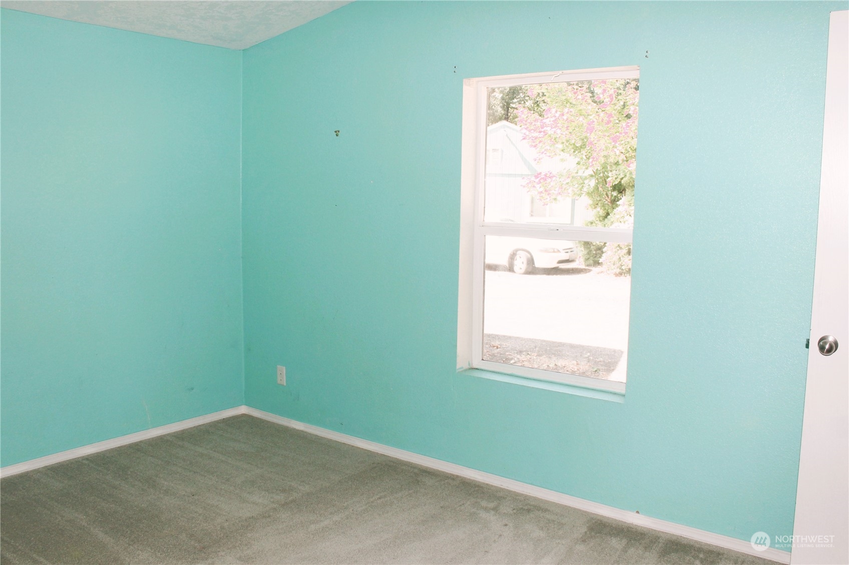 8145 183rd Avenue Southwest Rochester, WA 98579 - Photo 18 of 33 a view of an empty room with a window