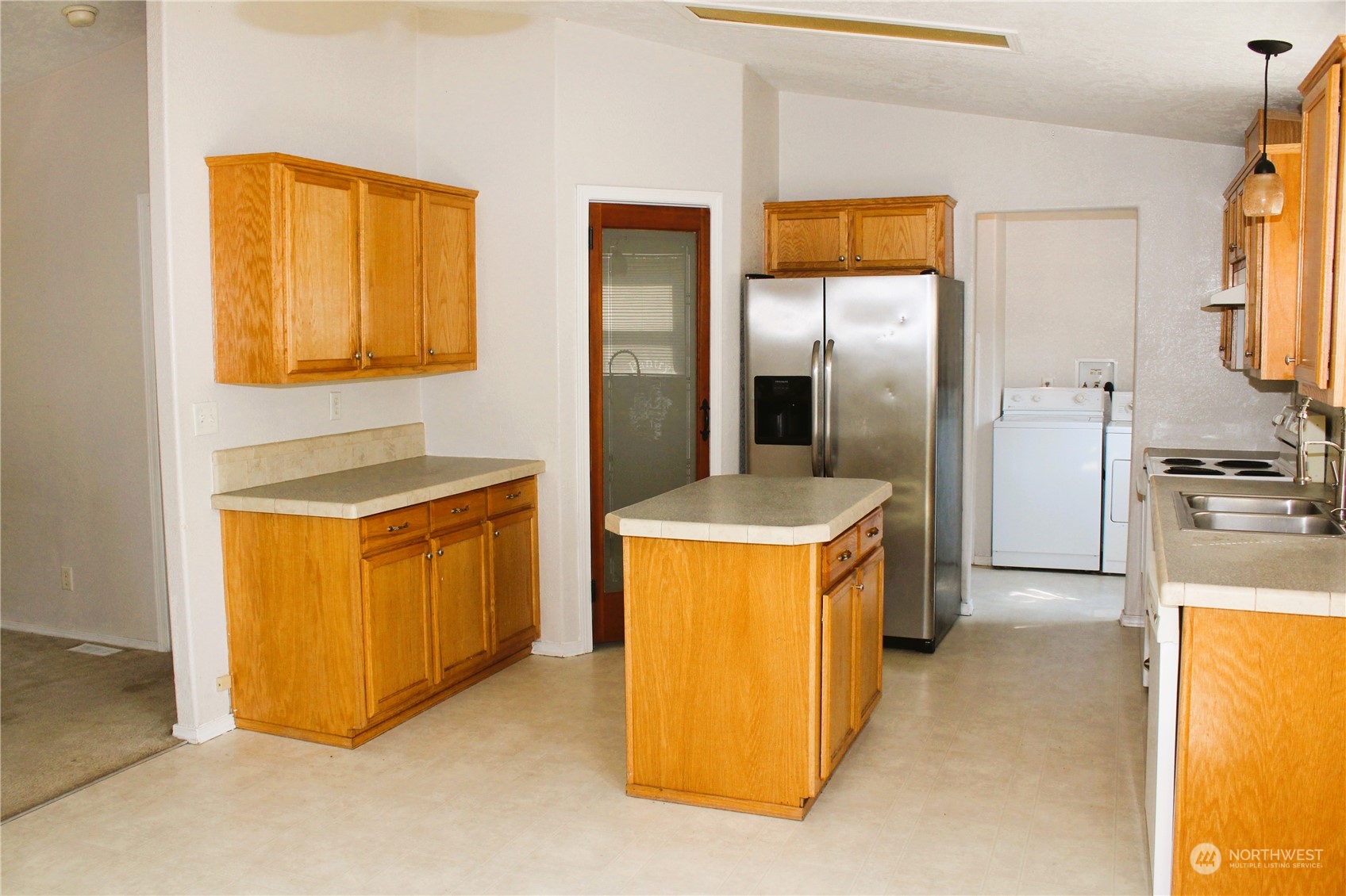 8145 183rd Avenue Southwest Rochester, WA 98579 - Photo 8 of 33 a kitchen with stainless steel appliances granite countertop a stove and a refrigerator