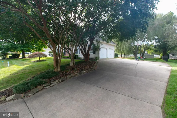 a view of a house with a yard and garage