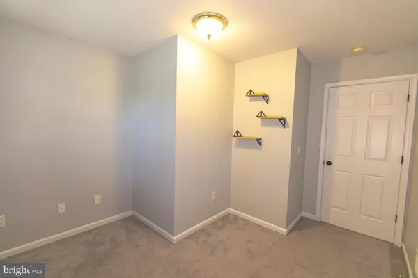 a view of a room with racks and racks on the wall