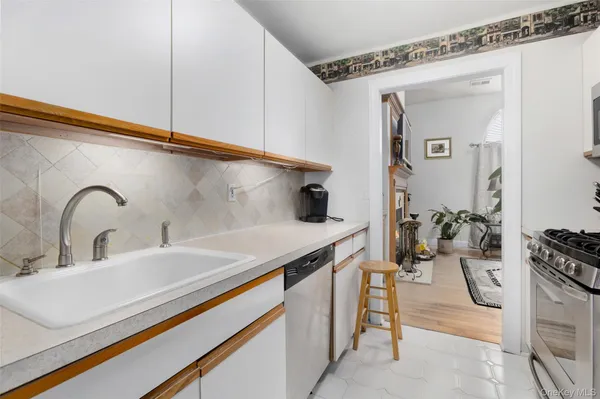 a bathroom with a sink and mirror