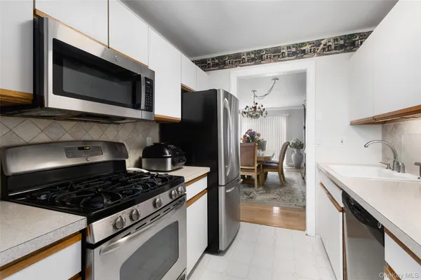 a kitchen with a stove and a microwave