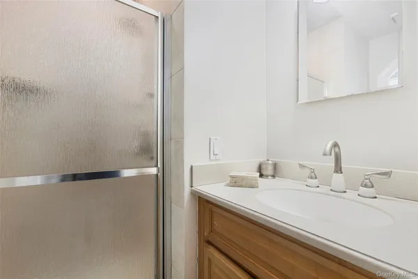a bathroom with a sink and a mirror