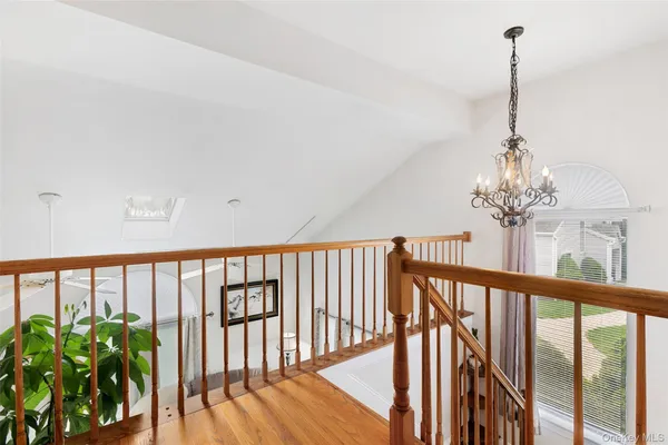 a view of a balcony with wooden floor