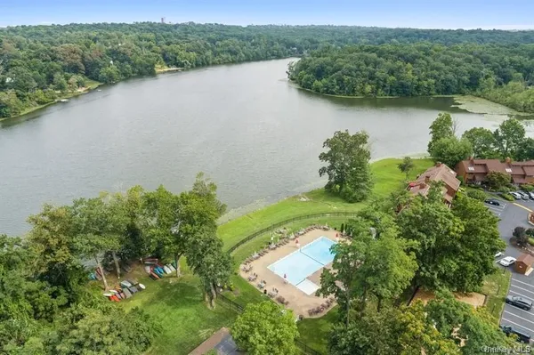 an aerial view of a house with a lake view