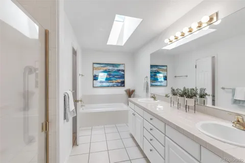 a bathroom with a toilet a sink and a tub