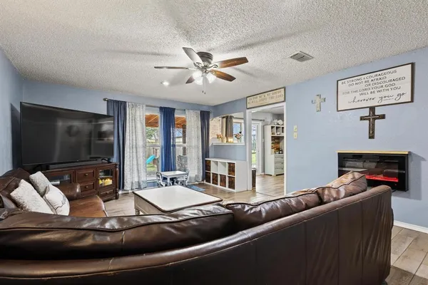a living room with furniture and a flat screen tv