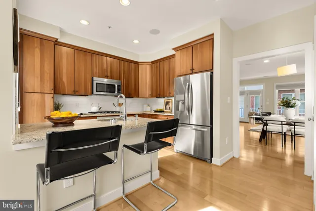 a kitchen with sink cabinets and microwave oven