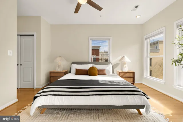 a bedroom with a large bed and a window