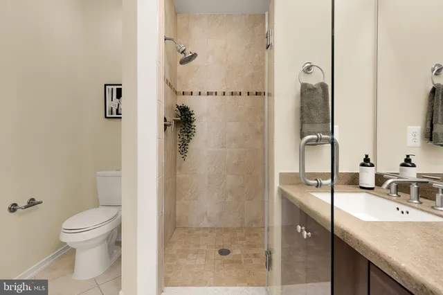 a bathroom with double sink and a mirror