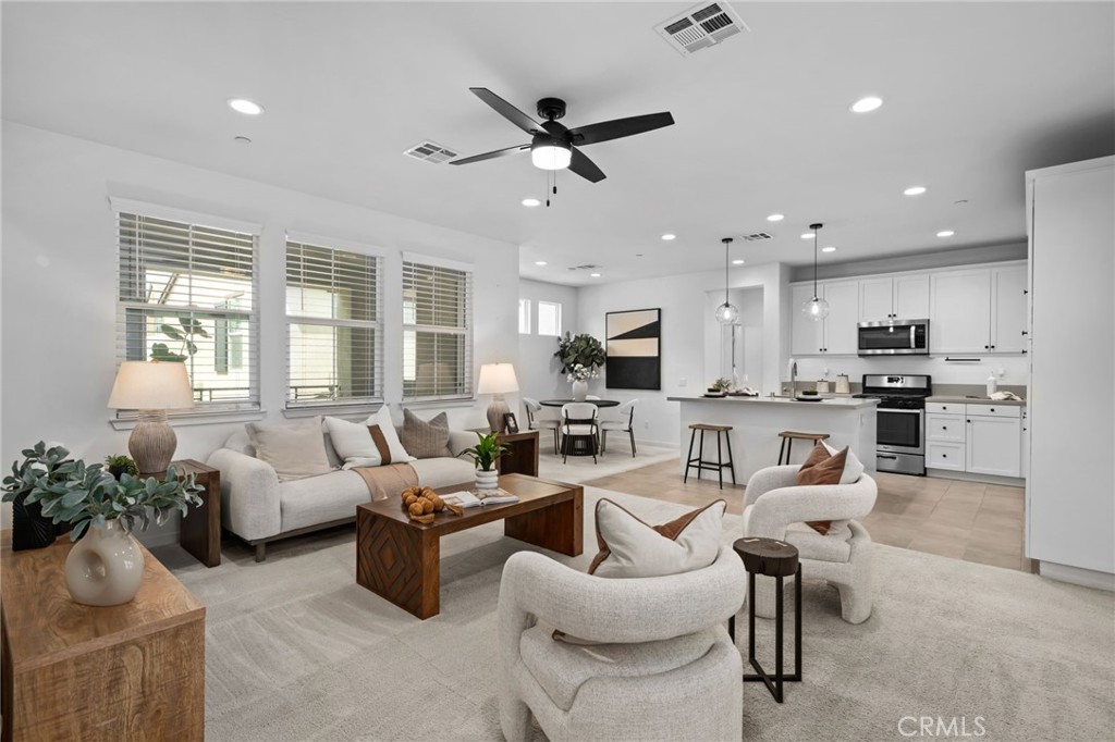 9463 Retreat Place Rancho Cucamonga, CA 91730 - Photo 1 of 37 a living room with furniture kitchen view and a window
