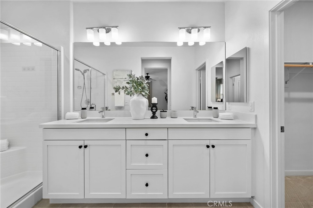 9463 Retreat Place Rancho Cucamonga, CA 91730 - Photo 17 of 37 a bathroom with white cabinets and a sink