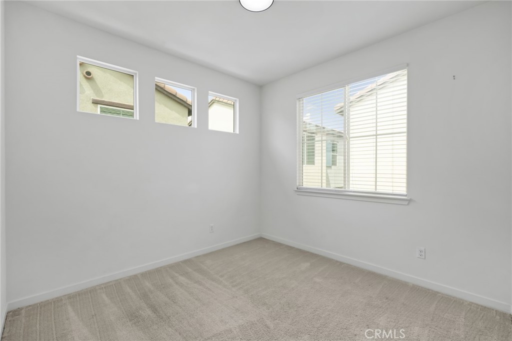 9463 Retreat Place Rancho Cucamonga, CA 91730 - Photo 23 of 37 an empty room with windows