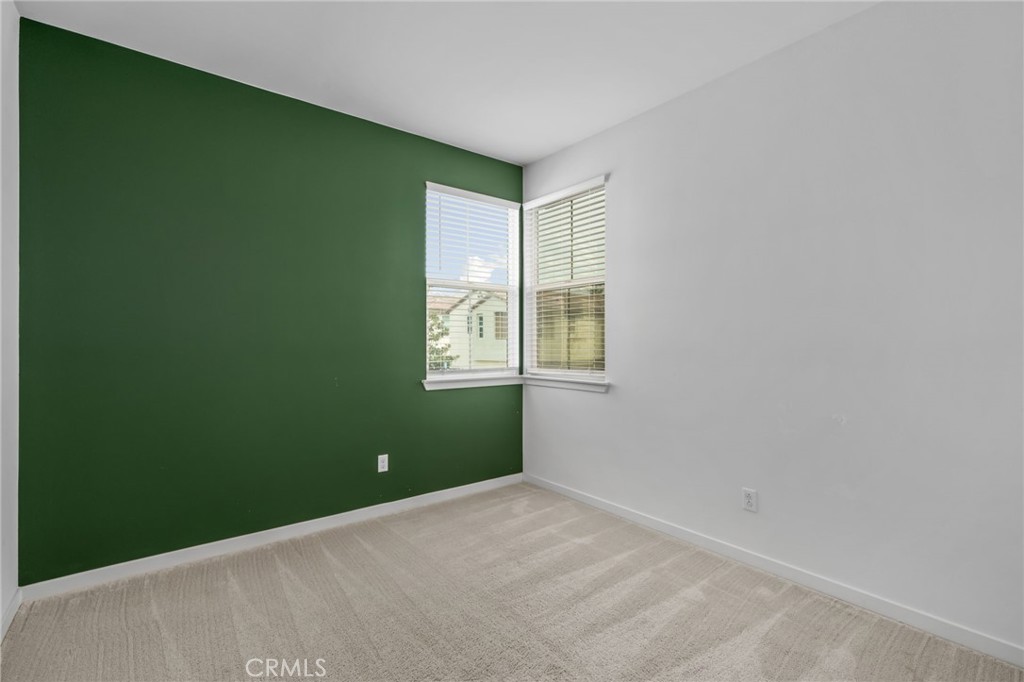 9463 Retreat Place Rancho Cucamonga, CA 91730 - Photo 25 of 37 a view of a room with a window and a ceiling fan