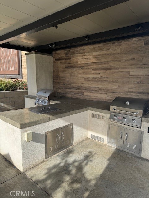 9463 Retreat Place Rancho Cucamonga, CA 91730 - Photo 33 of 37 a kitchen with stainless steel appliances granite countertop a sink and a stove