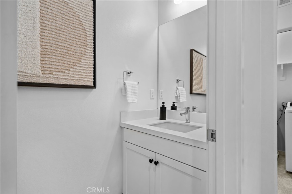 9463 Retreat Place Rancho Cucamonga, CA 91730 - Photo 8 of 37 a bathroom with a sink and a mirror