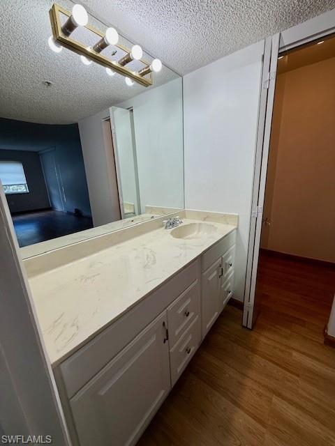 3910 Inverrary Boulevard, Unit 407B Lauderhill, FL 33319 - Photo 14 of 28 a bathroom with a double vanity sink and a mirror
