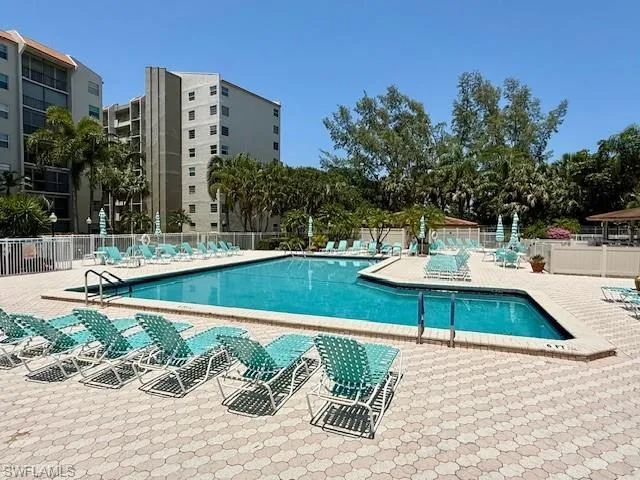 a view of a swimming pool with a patio