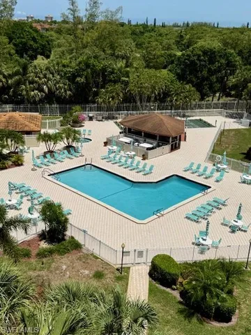 a view of a swimming pool with a yard