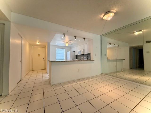 3910 Inverrary Boulevard, Unit 407B Lauderhill, FL 33319 - Photo 7 of 28 a view of a kitchen with kitchen appliances and cabinets