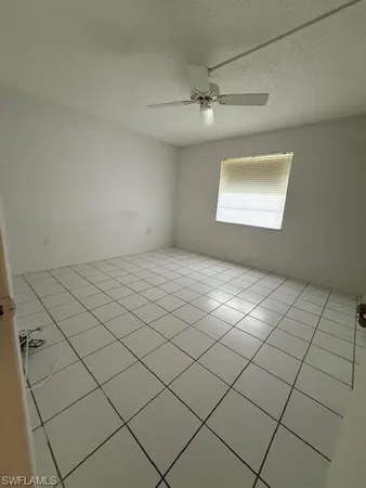 a view of an empty room and a window