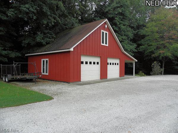 7204 Hartman Road Wadsworth, OH 44281 - Photo 14 of 20 Massive out building with 2 car garage car port and second floor storage.