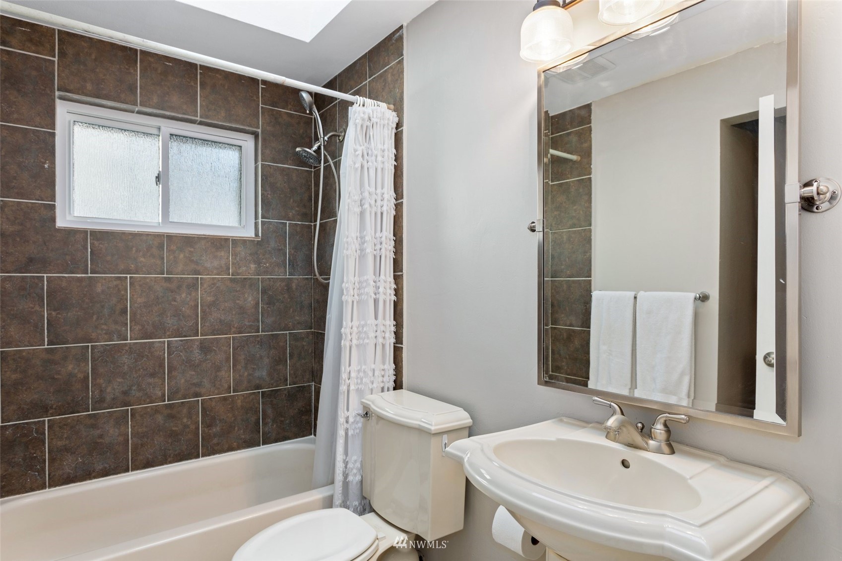 4805 Northeast 21st Street Renton, WA 98059 - Photo 20 of 40 a bathroom with a sink a toilet and shower