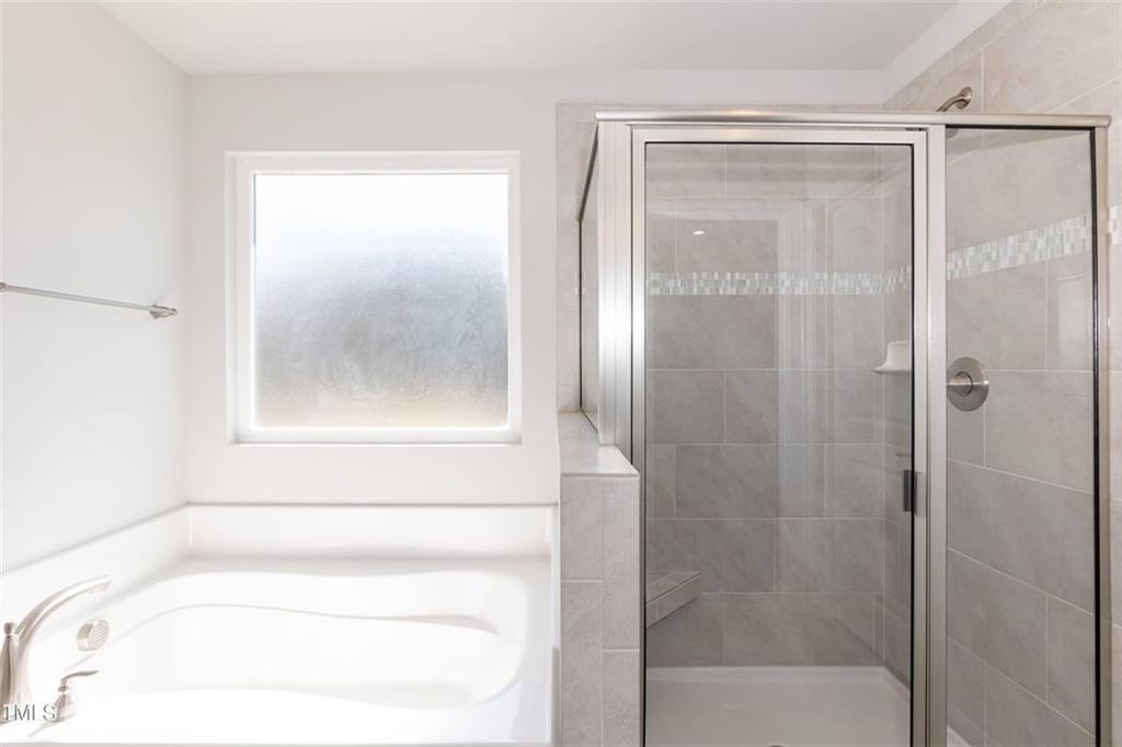 654 Bald Ridge Circle Demorest, GA 30535 - Photo 20 of 22 a bathroom with a glass shower door