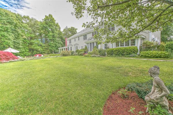 3 Gussett Road Wenham, MA 01984 - Photo 7 of 30 a front view of a house with a garden and yard