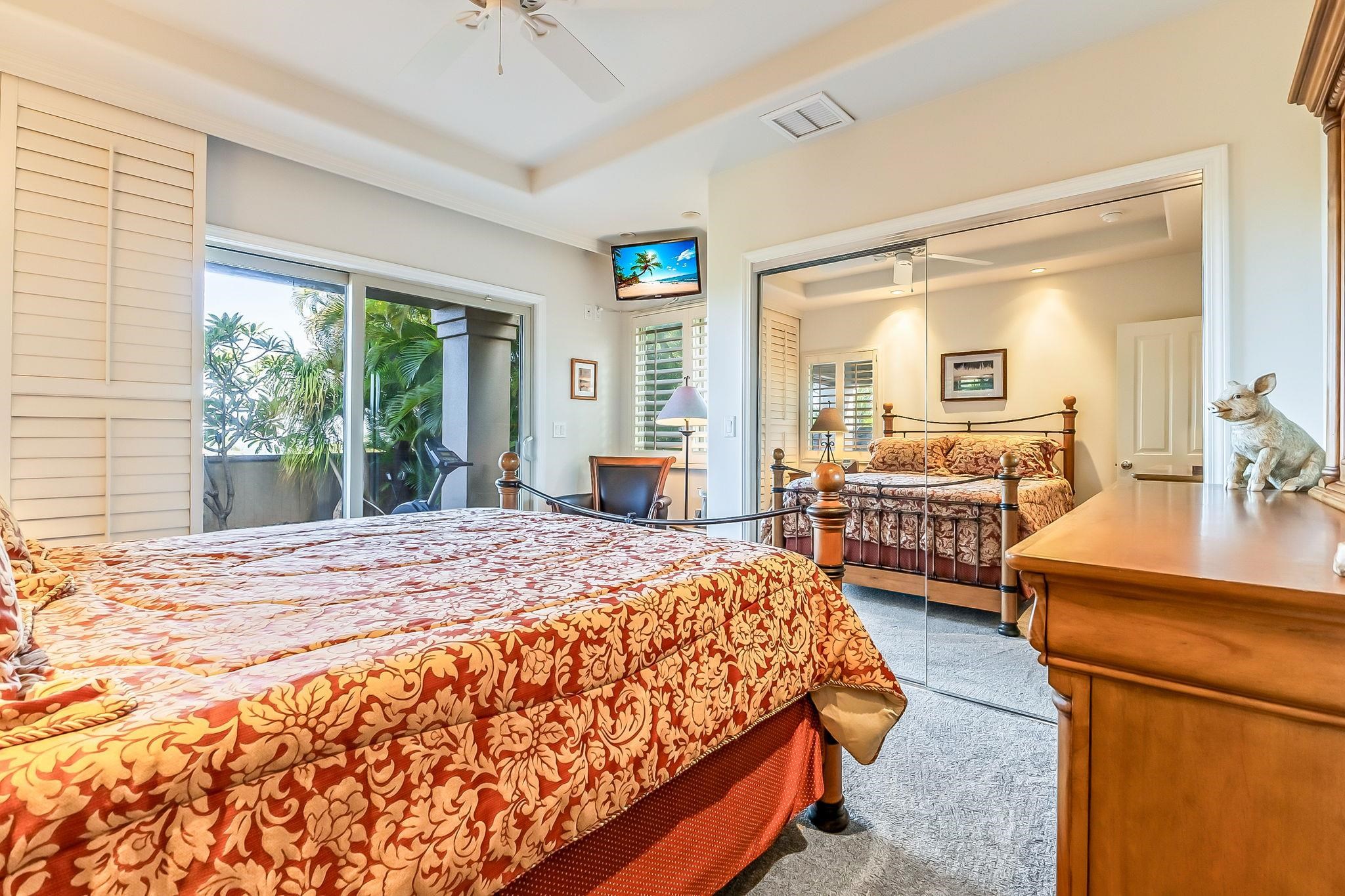 302 Kahana Ridge Drive Lahaina, HI 96761 - Photo 25 of 50 a bedroom with a bed couch and large windows