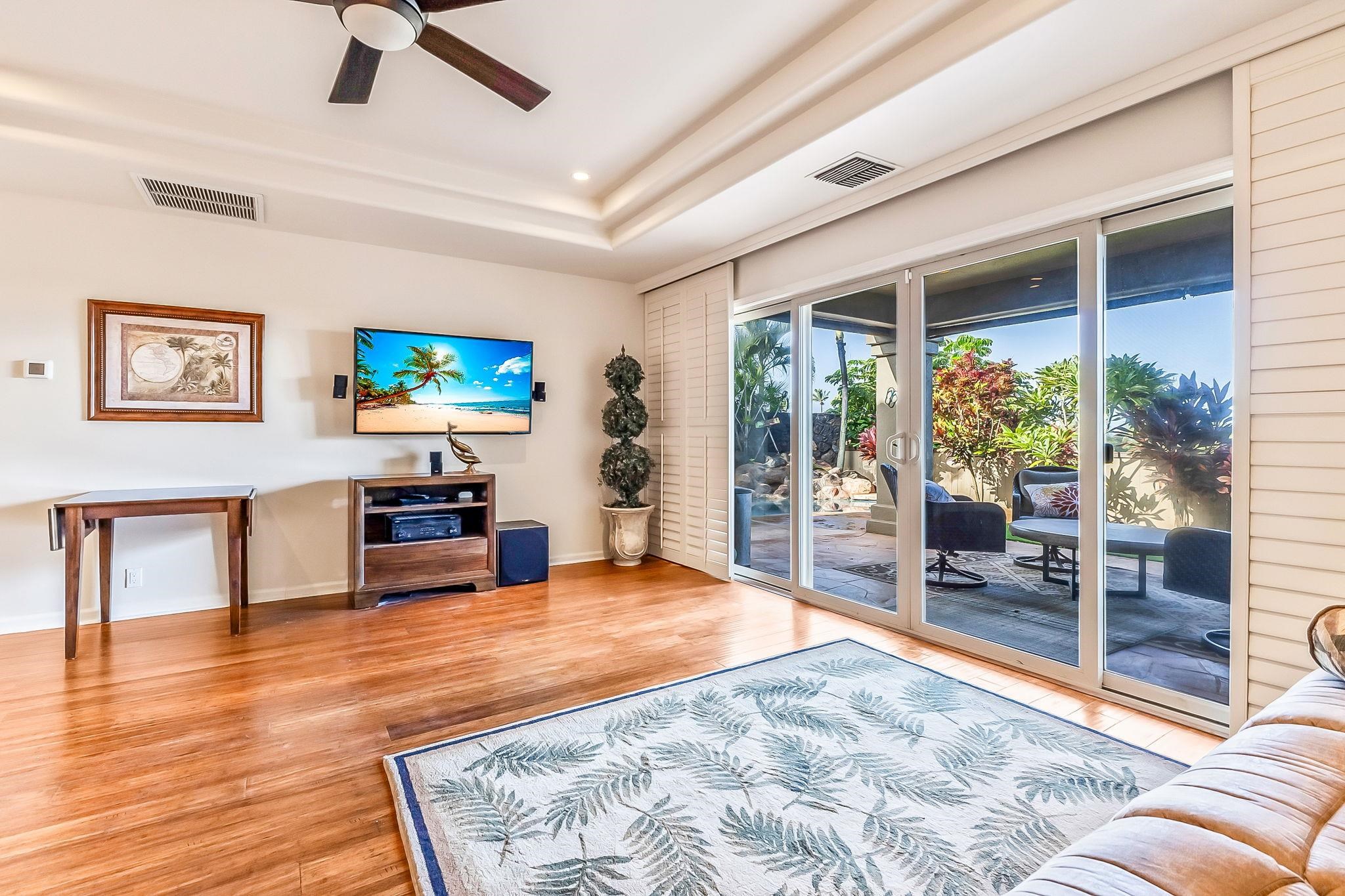 302 Kahana Ridge Drive Lahaina, HI 96761 - Photo 33 of 50 a living room with furniture and a flat screen tv